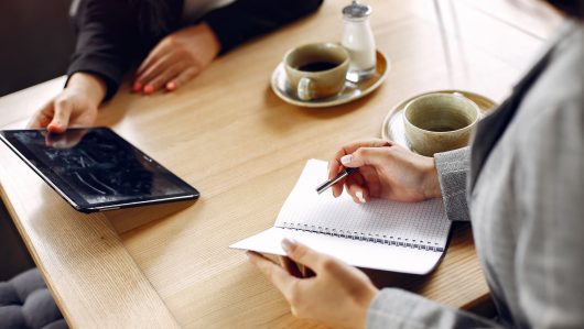 two-businesswomen-working-cafe